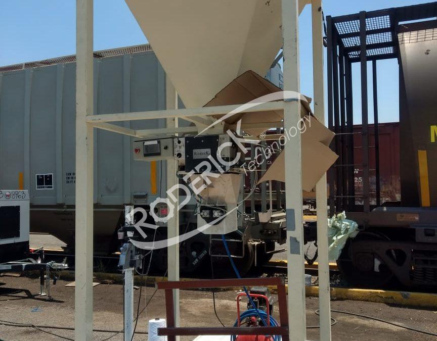 Sistema de descarga de ferrocarril a costal